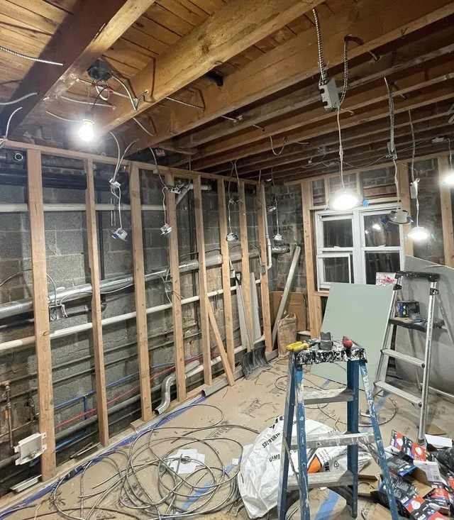 Kitchen remodel electrical rough-in with exposed joists, framing and new wiring