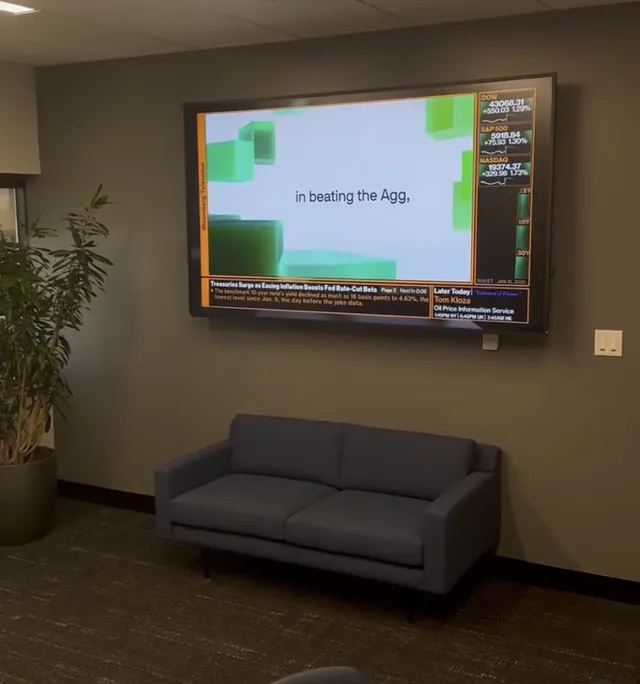 Large display mounted over a sofa in a waiting area