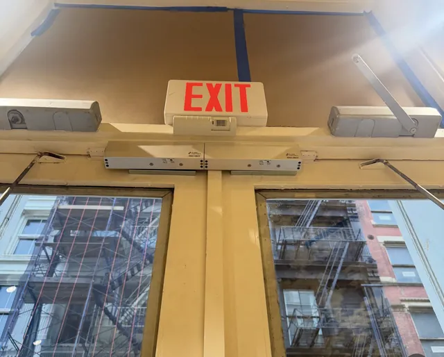 Magnetic lock and IR exit sensor installed above a double exit door