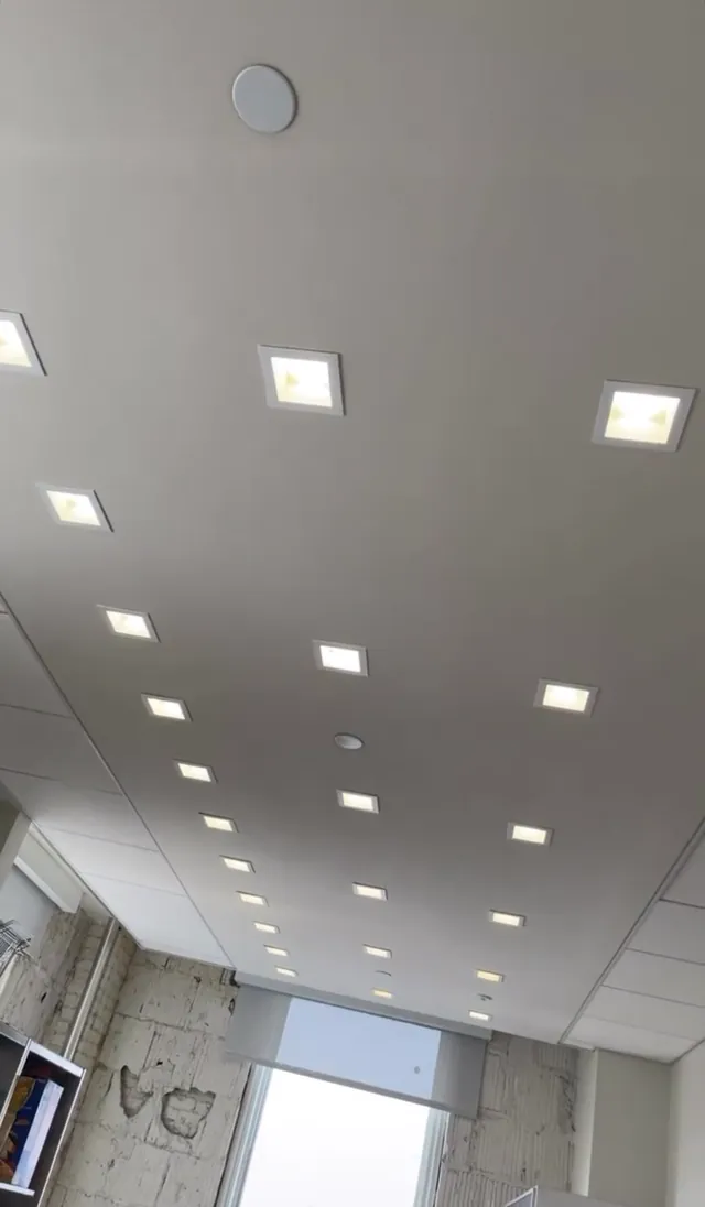 Ceiling with evenly spaced square recessed lights
