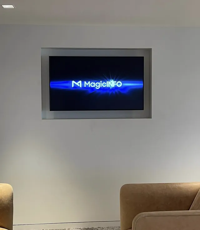 55-inch display on a swivel mount recessed into a wall niche