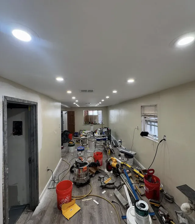 Renovated hallway with recessed lighting installed