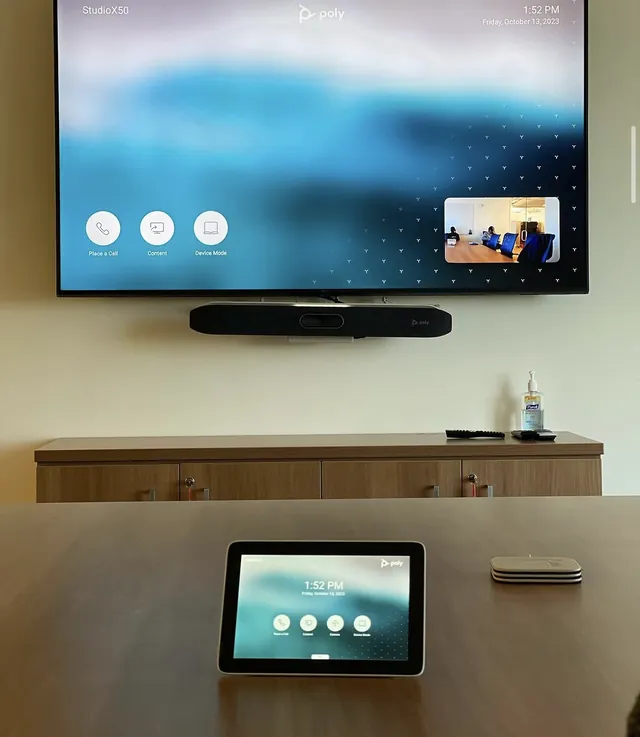 Conference room with 70-inch display, Poly Studio X50 video bar and touch controller
